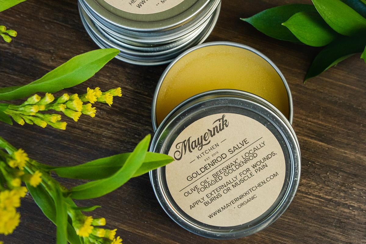 Mayernik Kitchen Golden Rod Salve opened on a wood board